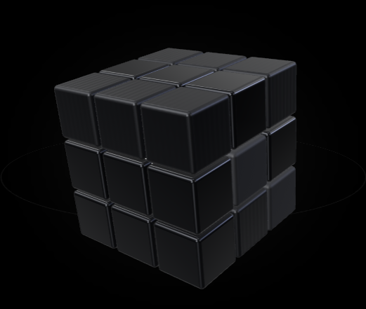 Black segmented cube with subtly textured faces under white lighting